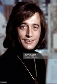 Singer songwriter Robin Gibb of the musical group The Bee Gees poses...