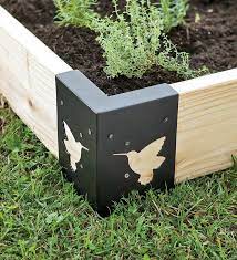 How to make a raised garden bed including guidance on the best sizes, types of wood, and what to fill them with to grow vegetables. Raised Bed Corner Brackets For My New Garden Im Thinking I Should Make These Out Of Copper Sheeting Raised Bed Corners Raised Bed Garden Design Raised Beds