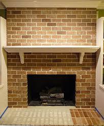 You'll need to use a good primer and sealer on the brick first to stop the soot from coming through and staining the paint. Painting Brick Fireplace From White To Beautiful Brownstone Pretty Handy Girl