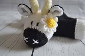 He has a white body, yellow nose and ears, and brown fists, feet, and horns. Lazy Daisy Knitting Pattern Knitting By Post
