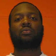 Man found shot to death along road at city limits