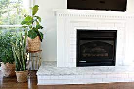 Hexagon cement tile fireplace hearth. 24 Beautifully Tiled Fireplaces