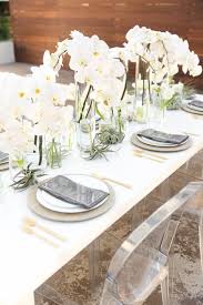 Modern dining table centerpiece ideas with artificial flowers. Modern Wedding Table Setting With Cascading Orchids Centerpiece Modernwedding Orchids Wedding Table Settings Orchid Centerpieces Contemporary Wedding Decor