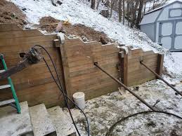A concrete retaining wall will likely last many years. Helical Tiebacks What They Cost How They Re Used Acculevel