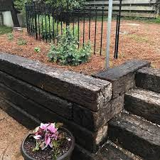 Railroad ties landscaping can also be built in combination with sand, brick, concrete, gravel or other large rocks. We Love Replacing Old Cinderblock With Railroad Ties It S Is Less Expensive And A Landscaping Retaining Walls Landscaping With Rocks Railroad Ties Landscaping
