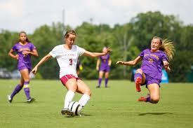 Elon Womens Soccer Player Angela Funari Evades A Tackle