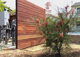 Hide your pool pump and filter with a wall, box or small pool shed. Pool Equipment Mangaris Wood Screen Contemporary Los Angeles By Outside Instyle Houzz