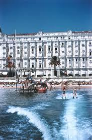 Holiday Makers Water Skiing In Front Of The Carlton Hotel Cannes 1958 See More Amazing Gift Ideas Starting At Just 6 Slim Aarons France Travel Carlton Hotel