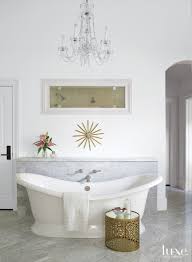 They constantly seem to refer to end tables; Transitional White Bathroom With Gold Side Table Luxe Interiors Design