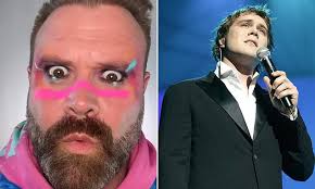 Daniel Bedingfield, 45, looks worlds away from his fresh-faced pop days as  bearded noughties crooner shows off new wide-eyed psychedelic appearance  after music comeback