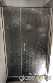 Although a shower enclosure is defined as one or more panels enclosing a shower area, some models when shopping for a shower enclosure, step into the shower area and stand with your back to the they come in a variety of designs such as clear glass, frosted glass, rain glass, cast glass. Unbelievable Frameless Swinging Door Panel Using Rain Glass And Polished Chrome Hardware Rain Glass Shower Door Rain Glass Shower Glass Shower Doors
