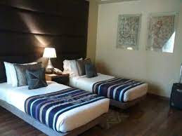 It has 2 single beds, large study desk, big cupboard for 2 people, chairs, bedside tables with drawers, balcony with a big french window. Double Room Twin Sharing Picture Of The Visaya New Delhi Tripadvisor