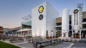 Milwaukee S Coolest Offices The Factory Combines Office Space With A Brewery Office Space Cool Office Rooftop Patio