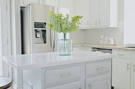 Farmhouse Style Kitchen With Sherwin Williams Alabaster Painted Kitchen Cabinets And Kitche Faux Marble Countertop Farmhouse Style Kitchen Grey Kitchen Island