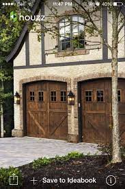 Wood garage doors look great on any home. Pin By Tia Leitermann On Living In A Dream Carriage Style Garage Doors Garage Door Design House Exterior