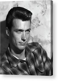 Young Clint Eastwood Looking Up Acrylic Print by Globe Photos