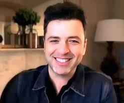 man smiles despite struggles