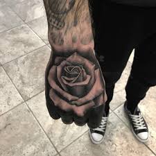 Black And Grey Realism Custom Rose Hand Tattoo By Aaron Carey Rose Hand Tattoo Hand Tattoos Tattoos For Guys