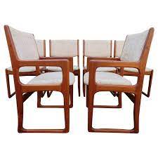 The table has good bones but the surface is incredibly damaged. Handsome Set Of 6 Danish Benny Linden Teak Dining Chairs Mid Century Modern For Sale At 1stdibs
