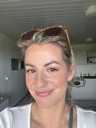 Is the regular or tinted Sun Shield light weight or too heavy to wear under  makeup?