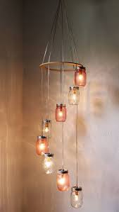 Unwrap your copper led fairy tale lights and neatly push them into the jars. Turning Mason Jars Into Light Fixtures