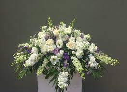 Casket spray purple and white funeral flowers. White Purple Casket Spray In San Jose Ca Valley Florist