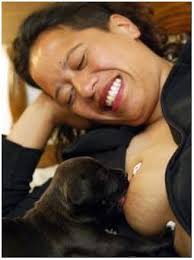 The Woman Is Feeding The Puppy With Breast Milk Photo Fact Women Are Breastfeeding Baby Animals Photo Video