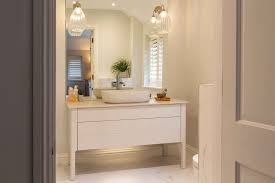 Brighter bathroom lighting makes precision tasks, like applying makeup and shaving, easier and installing a combination of bathroom light fixtures, including wall and ceiling lights, will reduce shadows cast across your face. How To Make A Big Impact In A Small Bathroom Littlejohn Bathrooms