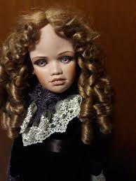 A new addition to my house is this Lynn McEntire doll. She will eventually  be going into the doll shop (when it's assembled and furnished). I can't  find very much information about