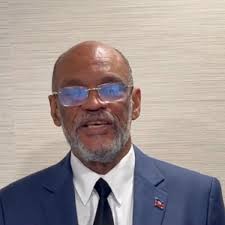 After prime minister pledges to step down, uneasy quiet in Haiti capital