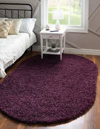 The primary color is eggplant purple. Eggplant Purple 8 X 10 Solid Shag Oval Rug Esalerugs
