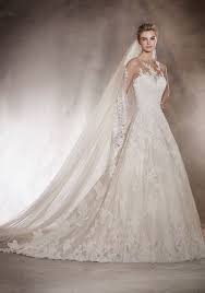 An Illusion Neckline Wedding Dress In A Line Silhouette With Cascading Lace Appliques Beads Featur Pronovias Wedding Dress Bridal Dresses Wedding Dress Cost