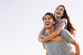 Young boy have fun wearing her girlfriend. Premium Photo Laughing Boyfriend Carrying Laughing Girlfriend At The Beach
