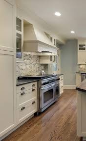 White shaker cabinets and granite black countertop with medium colour wood floor. Kitchen With Black Granite And White Cabinets Novocom Top
