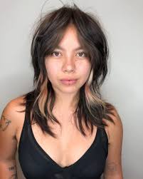 Why not give your long black hair a dose of cool color? Edgy Brunette Curtain Banged Shag With Messy Natural Texture And Pink And Blonde Peek A Boo Highlights The Latest Hairstyles For Men And Women 2020 Hairstyleology