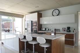 High Gloss White Melamine And American Walnut Veneer A Great Combination For A Modern White Gloss Kitchen White Modern Kitchen Kitchen Cabinets White Gloss
