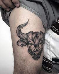 Taurus tattoo of bulls and flower for men on shoulder. Chest Taurus Tattoo For Guys Novocom Top