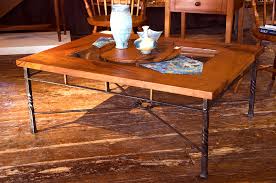 Give your space a modern yet rustic feel with this coffee table. Mesquite And Wrought Iron Coffee Table Mesquite Coffee Table With Glass Insert