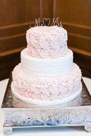 Three Tier Wedding Cake With Frosted Pale Pink Roses On The Bottom Top Tier Leslie Ann Photogra Rosette Cake Wedding Pink Wedding Cake Simple Wedding Cake