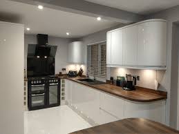 Range Cooker Angled Extractor Wine Racks Clerkenwell Gloss Units Walnut Block Worktops Plinth Lights Curved Kitchen Units Curved Kitchen Howdens Kitchens