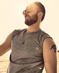 Chris evans in floral shirt with the tattoos peeking and the chain? Chris Evans Unveils His Secret Collection Of Tattoos Joe Jonas Dyes His Hair Pink And Other Buro 24 7 Singapore