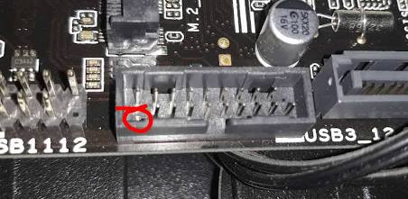 The USB 3.0 header: One wrong angle can instantly bend or bridge these fragile pins., AI generated