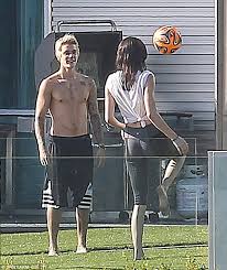 One reveals bieber, shirtless and rocking new york knicks shorts, sitting on a lawn, petting the pup. Kendall Jenner And Justin Bieber Get Physical In Beverly Hills Kendall Justin Bieber 2015 Kendall Jenner Style