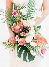 The bouquet was the perfect colorful and tropical design i adore out of a good bouquet, and it was tied together with a classy white satin ribbon wrapped around the stem and secured in place with decorative pearl head pins. How To Choose A Tropical Wedding Bouquet Blush And White Flowers And Greenery Roses Pe Wedding Bouquets Pink Tropical Wedding Bouquets White Wedding Bouquets