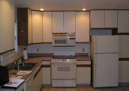 If you love white farmhouse kitchens and want to paint your kitchen white, then you will if you are wondering how to paint laminate kitchen cabinets, rest assured! Painting Particle Board Cabinets Best Of Particle Board Cabinets Kitchen Cabinets Kitchen Cabinets Makeover Kitchen Design