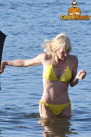Anna Faris in a soaked bikini outdoors revealing her tits