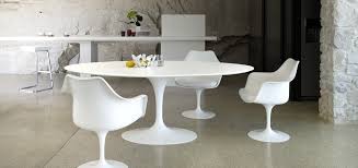 Use the table's sleek top as a canvas for a glass vase of timeless tulips or a bowl of faux fruit for a natural accent, then round out the look with a crisp white table runner for a timeless finishing touch. The Bloom That Doesn T Fade Saarinen S Tulip Table And Chairs