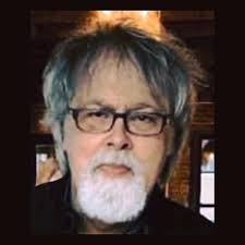 My husband Eddie Braddock is wearing his new Paul-Ronney Angel t-shirt