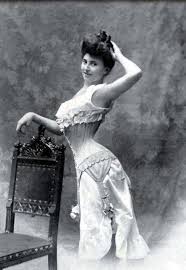 It shows pretty flowers and a gem portrait of an edwardian woman with her arms crossed. Edwardian Corset Atelier Nostalgia