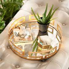 The mirrored gold tray is a circular shape with a mirrored base, and is completed with circular geometric edging. Pin On Home